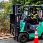 A student drives a forklift.